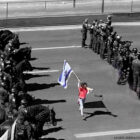 Protestor holding Israeli flag